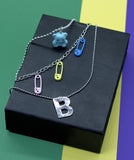 "Rainbow Pins: A Colorful Multilayer Chain Necklace"